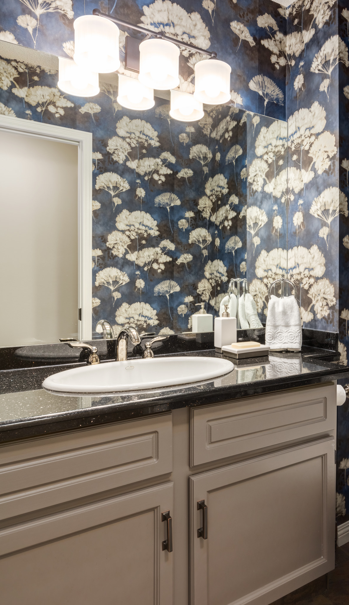 powder room refresh with wallpaper and painted cabinets