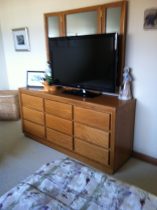 before pics of oak dessert wit black tv on the top in a spare bedroom