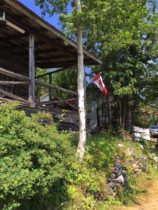 rustic cabin with Canadian flag